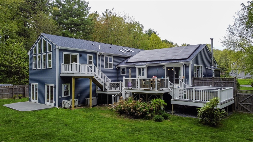 357 Ledge Road Seekonk, MA 02771 - Photo 39 of 42 a front view of a house with a garden