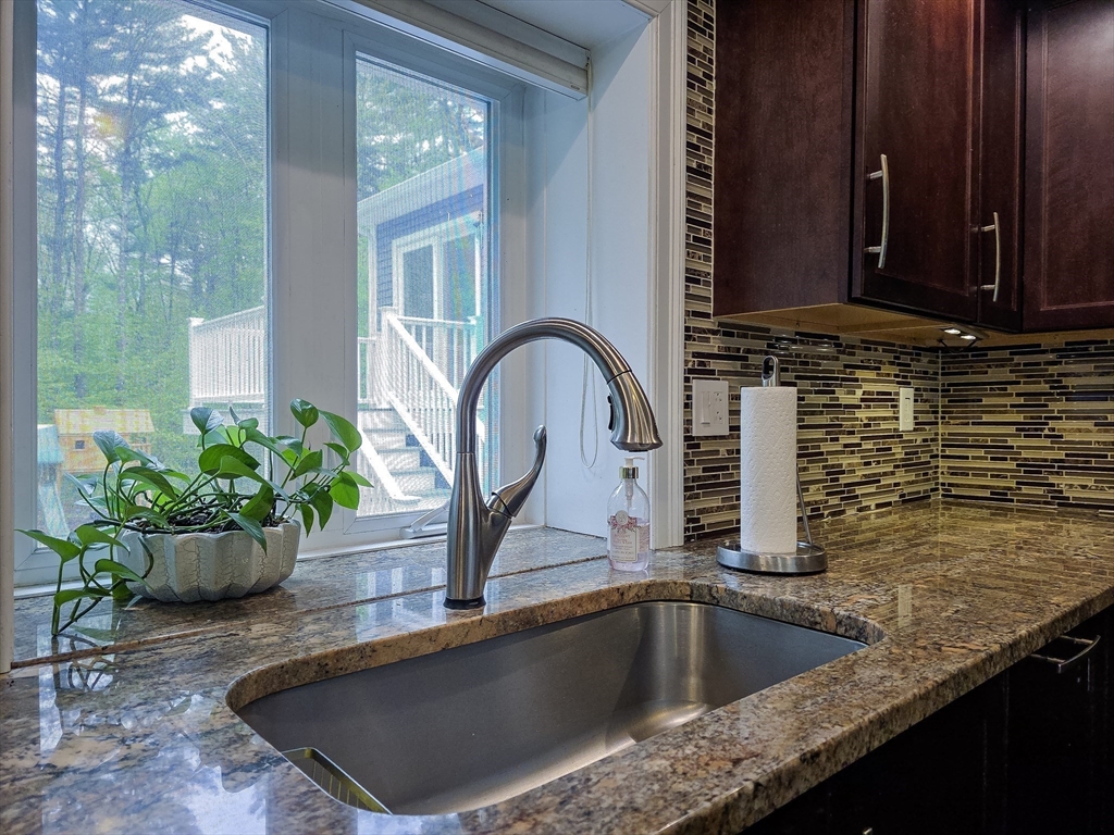 357 Ledge Road Seekonk, MA 02771 - Photo 8 of 42 a view of a kitchen sink and a potted plant