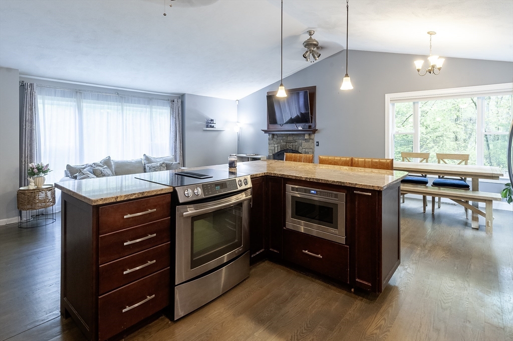 357 Ledge Road Seekonk, MA 02771 - Photo 9 of 42 a kitchen with a stove a sink and a refrigerator