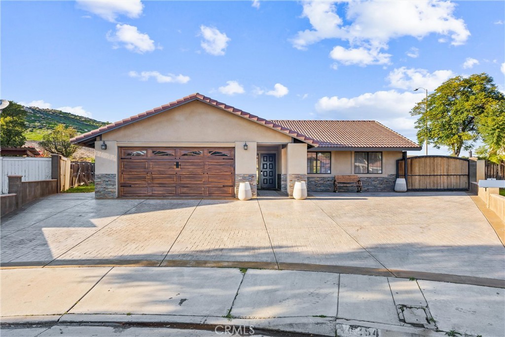4254 Manx Court Riverside, CA 92503 - Photo 2 of 38 a front view of a house with a garden