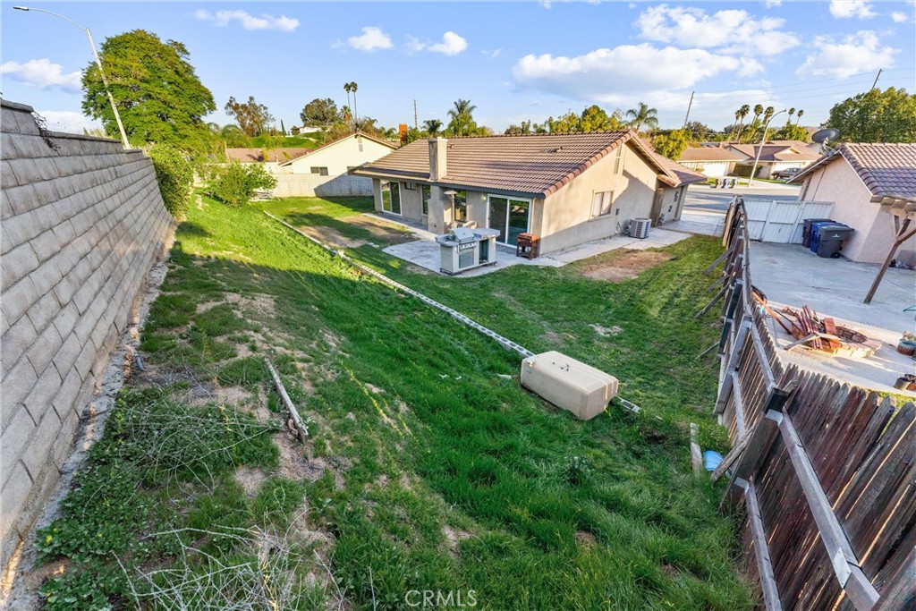 4254 Manx Court Riverside, CA 92503 - Photo 25 of 38 a view of a house with a yard and sitting area