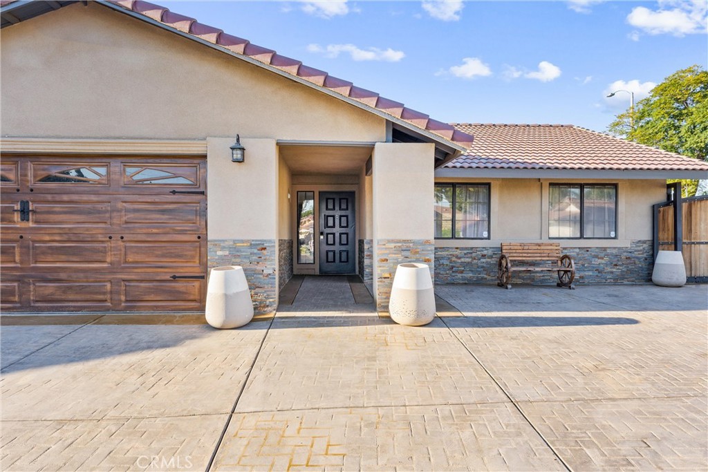 4254 Manx Court Riverside, CA 92503 - Photo 3 of 38 a view of a patio with couches chairs and potted plants
