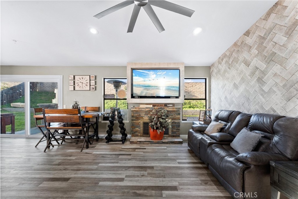 4254 Manx Court Riverside, CA 92503 - Photo 5 of 38 a living room with furniture and a flat screen tv with wooden floor