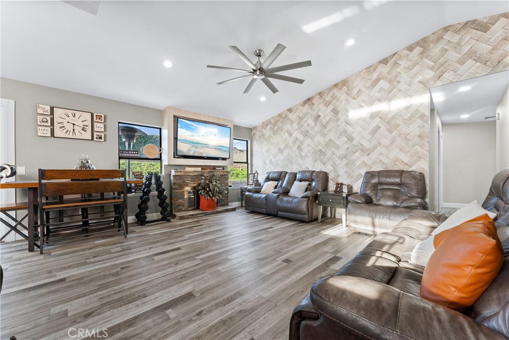 4254 Manx Court Riverside, CA 92503 - Photo 6 of 38 a living room with furniture a ceiling fan and a window