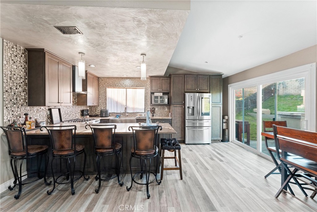 4254 Manx Court Riverside, CA 92503 - Photo 9 of 38 a view of a dining room with furniture and wooden floor