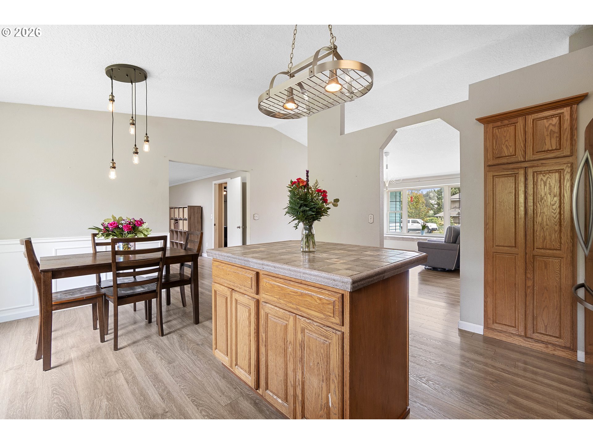 6749 Southwest 174th Place Beaverton, OR 97007 - Photo 14 of 39 a kitchen with a table and chairs