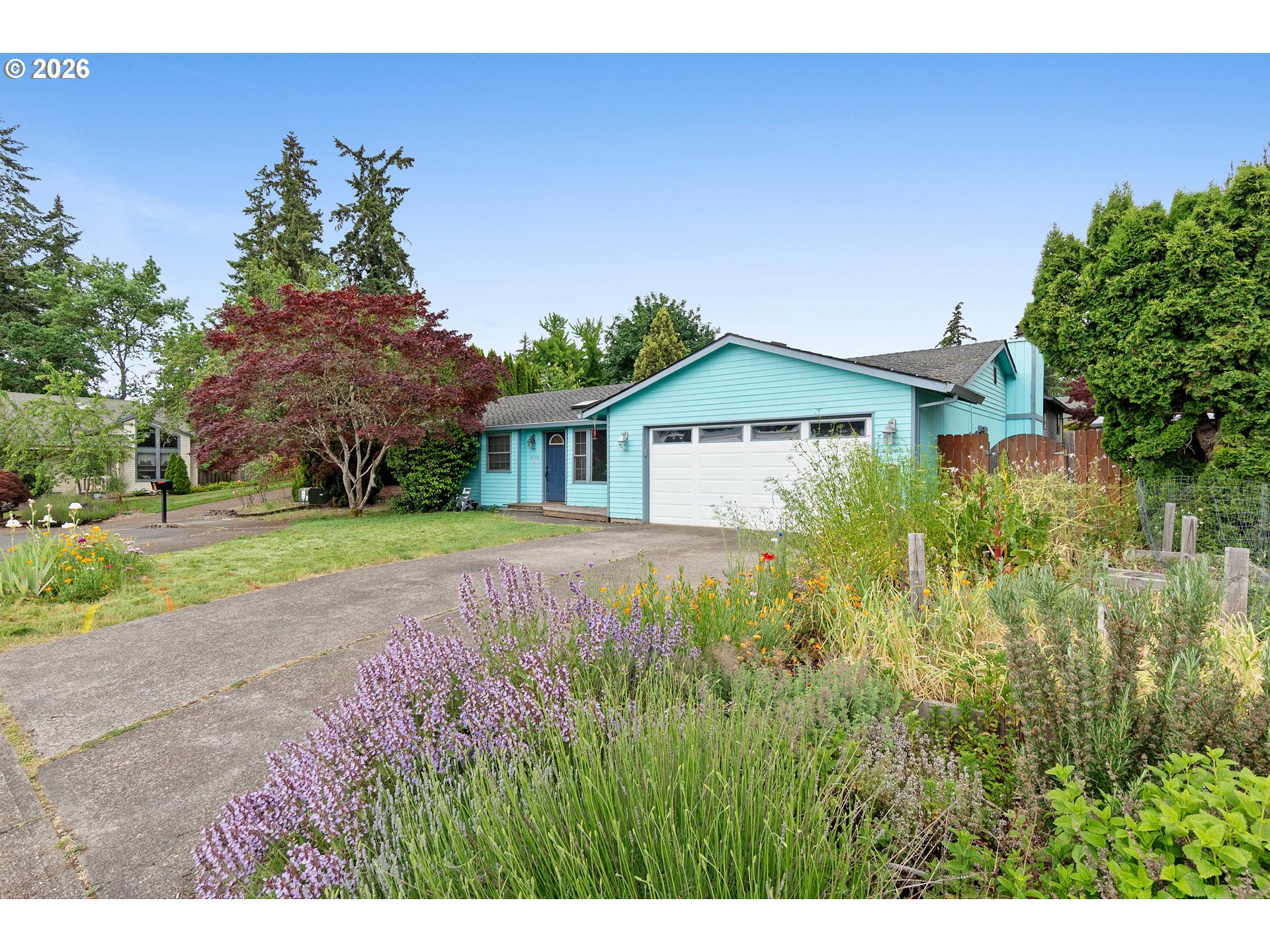 6749 Southwest 174th Place Beaverton, OR 97007 - Photo 2 of 39 a front view of a house with yard and green space