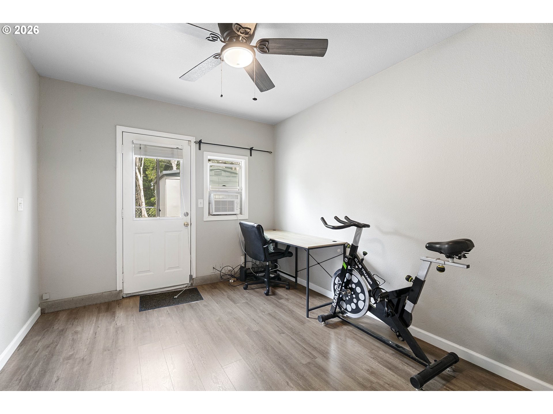6749 Southwest 174th Place Beaverton, OR 97007 - Photo 22 of 39 a view of a workspace with furniture and a window
