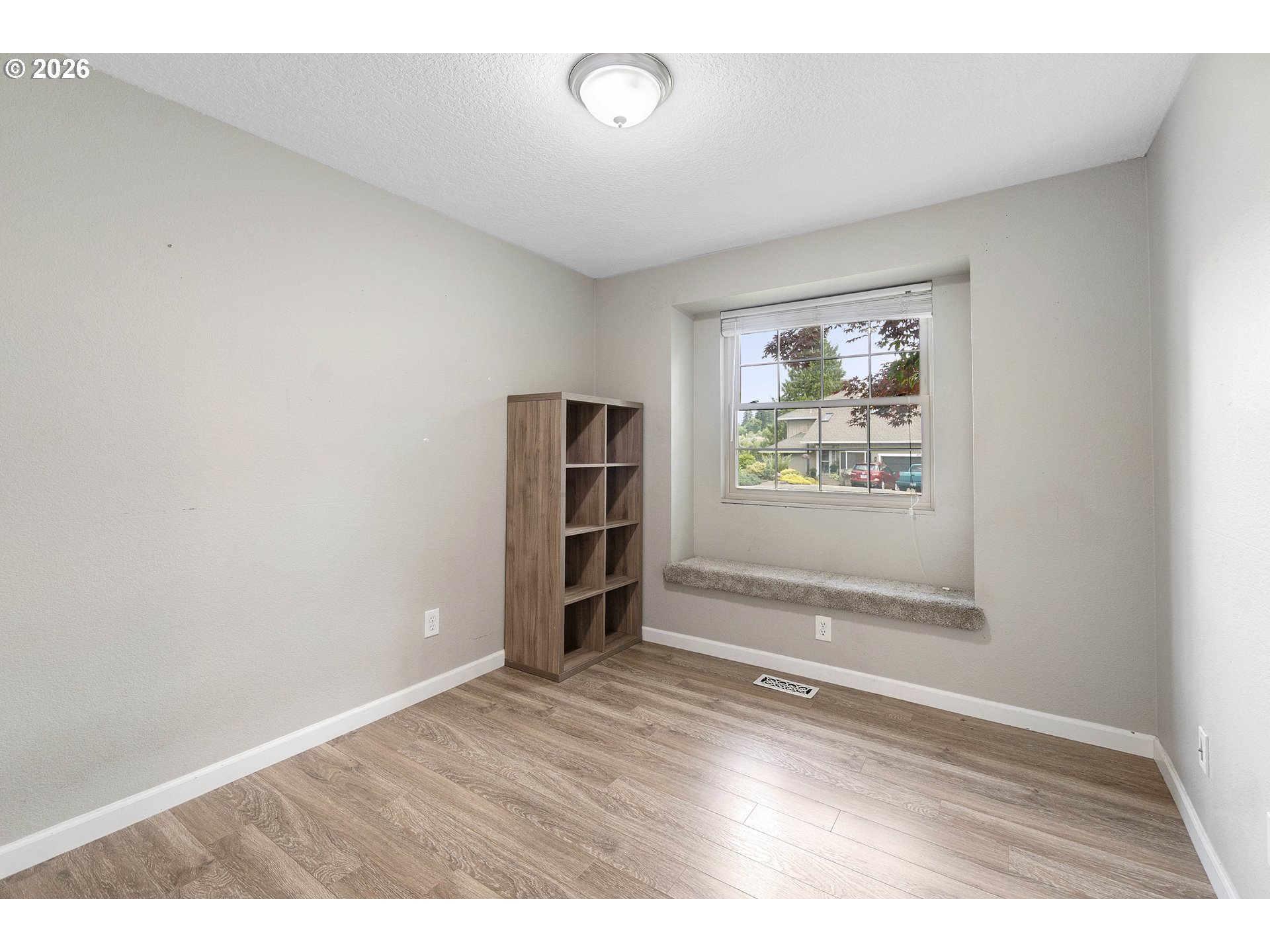 6749 Southwest 174th Place Beaverton, OR 97007 - Photo 25 of 39 wooden floor in an empty room with a window