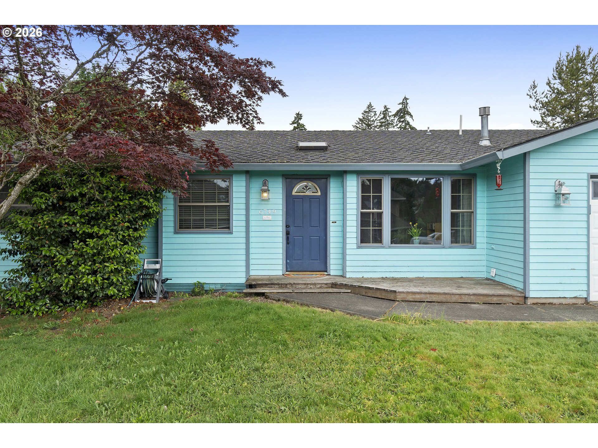 6749 Southwest 174th Place Beaverton, OR 97007 - Photo 3 of 39 a view of front of a house with a yard