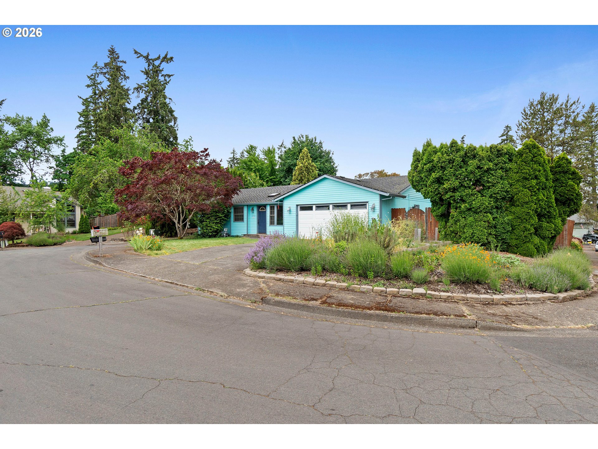 6749 Southwest 174th Place Beaverton, OR 97007 - Photo 38 of 39 a front view of a house with a yard and garage
