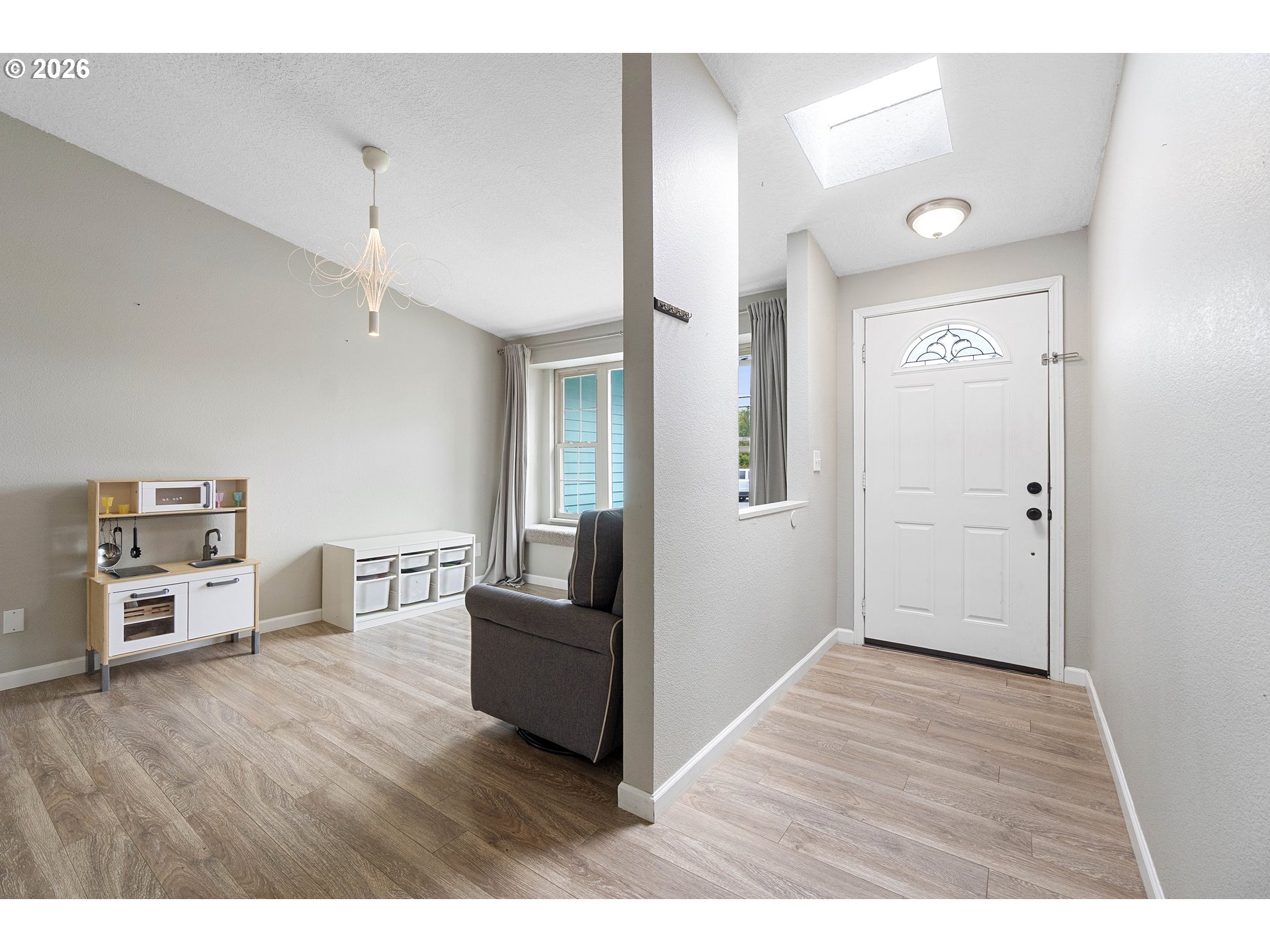 6749 Southwest 174th Place Beaverton, OR 97007 - Photo 5 of 39 a view interior of kitchen and hall with wooden floor
