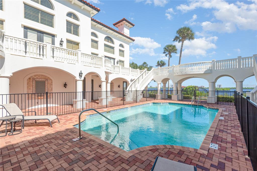5090 Riverside Drive, Unit 103 Port Orange, FL 32127 - Photo 16 of 62 a view of swimming pool with sitting area