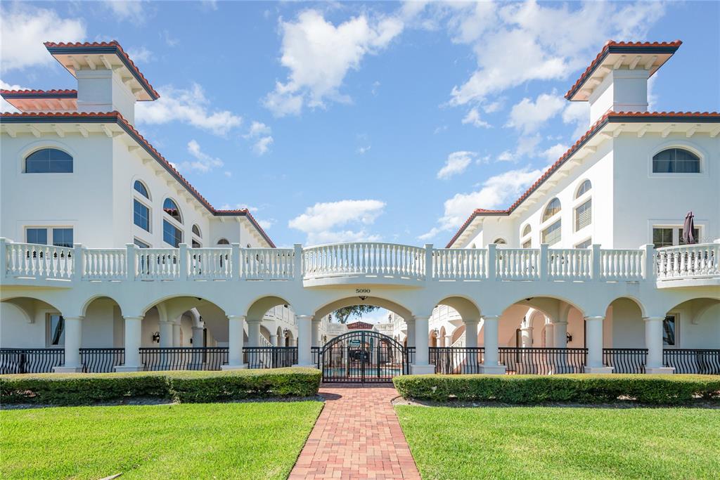 5090 Riverside Drive, Unit 103 Port Orange, FL 32127 - Photo 2 of 62 a front view of house and yard with green space