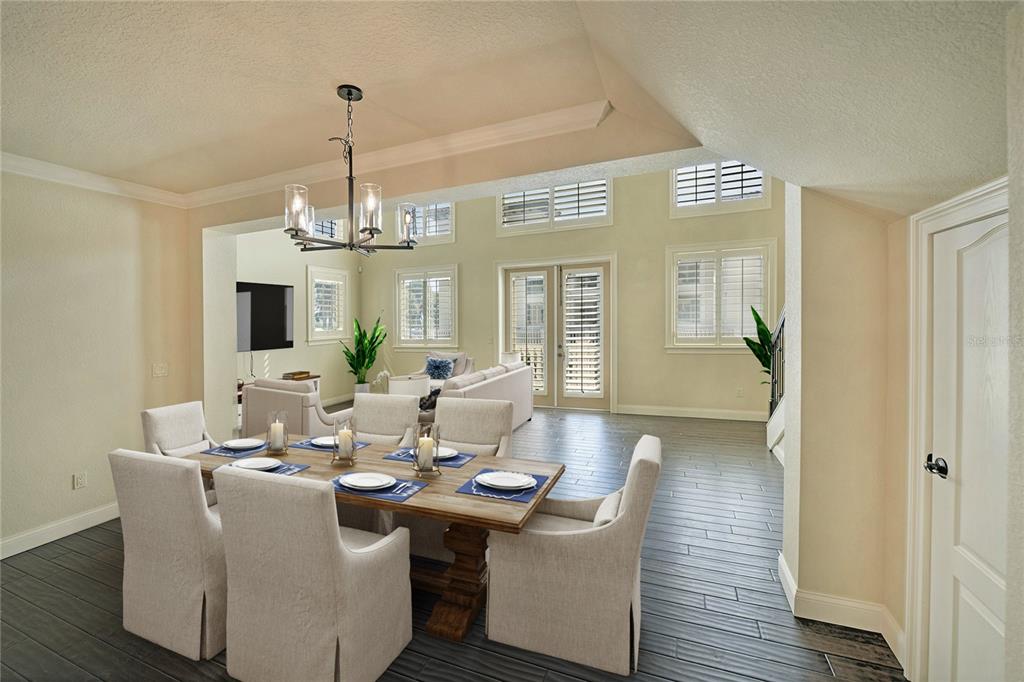 5090 Riverside Drive, Unit 103 Port Orange, FL 32127 - Photo 25 of 62 a view of a dining room with furniture window and wooden floor