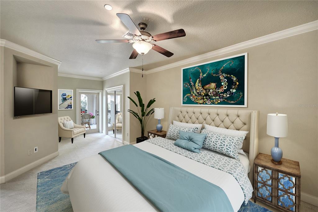 5090 Riverside Drive, Unit 103 Port Orange, FL 32127 - Photo 33 of 62 a bedroom with a large bed and a flat screen tv