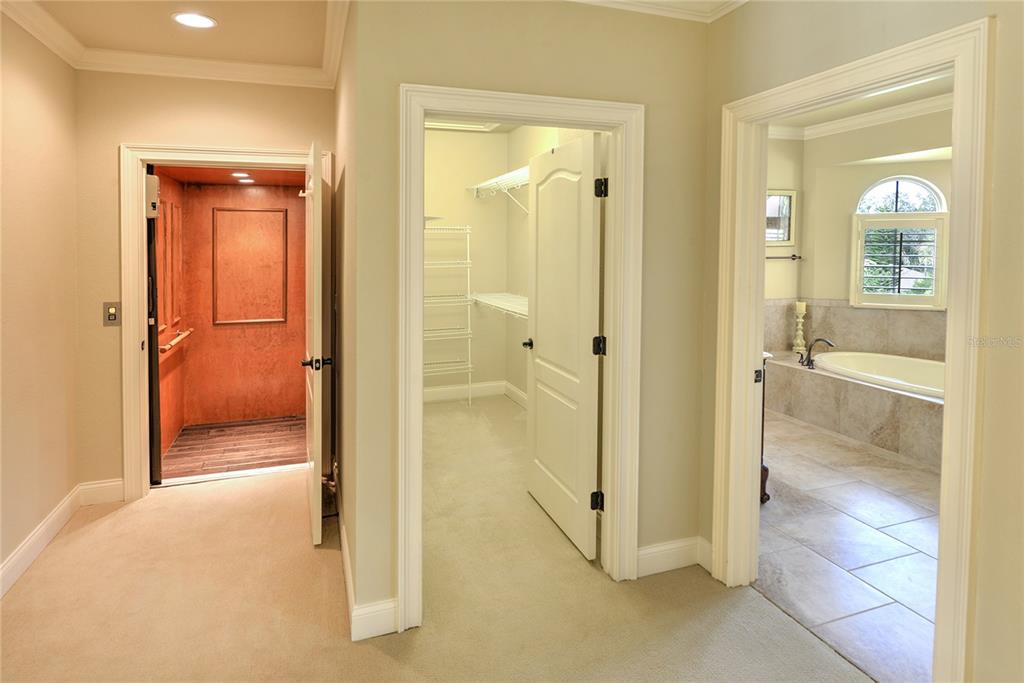 5090 Riverside Drive, Unit 103 Port Orange, FL 32127 - Photo 36 of 62 a view of a bathroom with a glass door shower