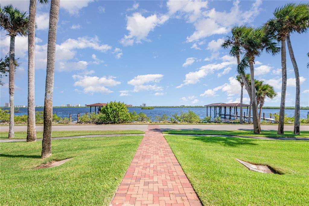 5090 Riverside Drive, Unit 103 Port Orange, FL 32127 - Photo 57 of 62 a view of a park with a big yard and potted plants