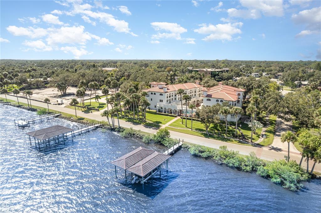 5090 Riverside Drive, Unit 103 Port Orange, FL 32127 - Photo 62 of 62 an aerial view of residential houses with outdoor space and swimming pool