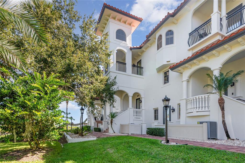 5090 Riverside Drive, Unit 103 Port Orange, FL 32127 - Photo 8 of 62 front view of house with a yard