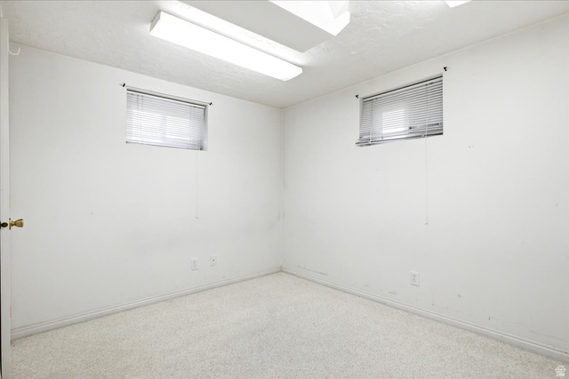 7050 South 260 East Midvale, UT 84047 - Photo 25 of 28 Room featuring two horizontal windows with blinds, wall-to-wall carpeting, and baseboard trim