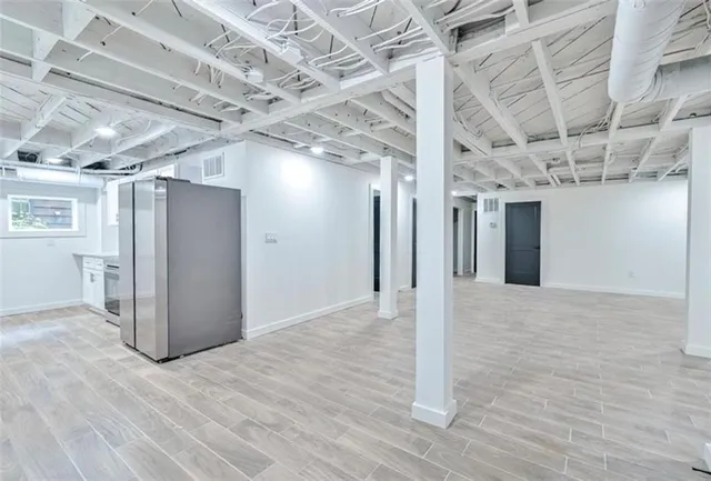 a view of a room with wooden walls