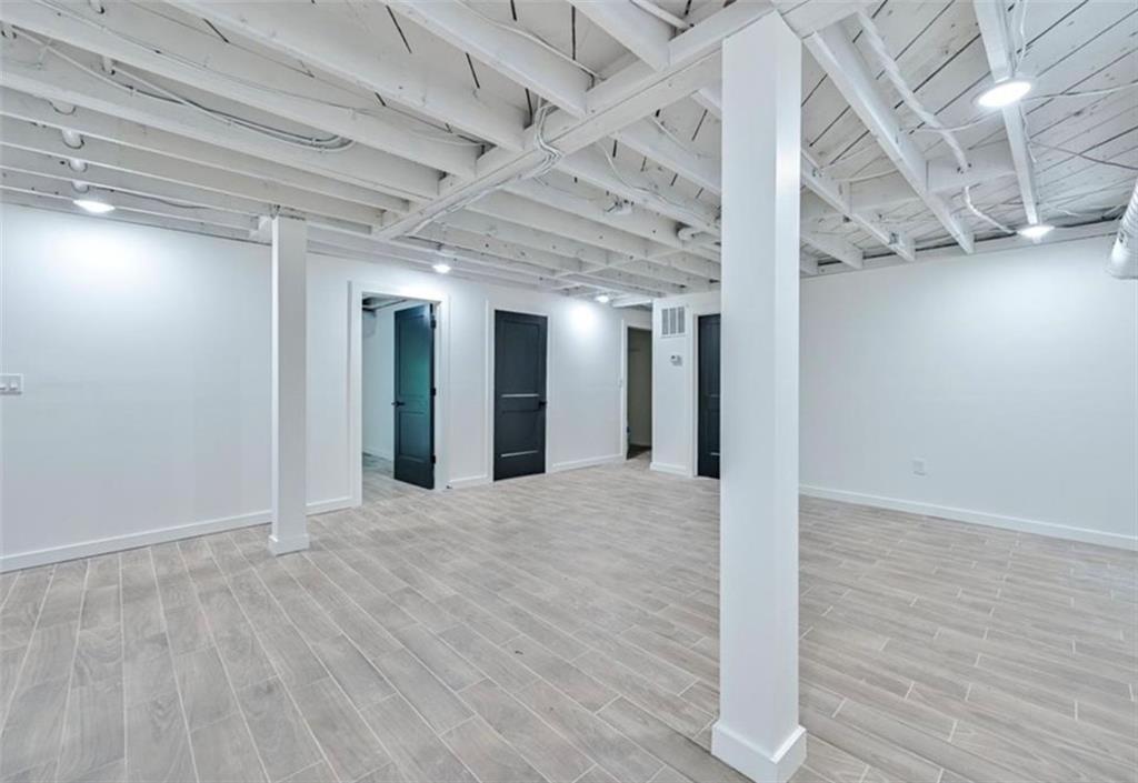 2218 Belvedere Avenue Southwest Atlanta, GA 30311 - Photo 5 of 13 a view of an empty room with wooden floor