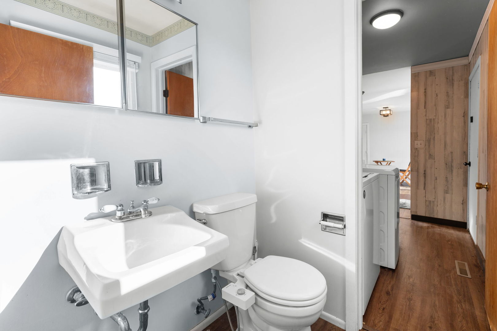5011-3 Three Oaks Road Crystal Lake, IL 60014 - Photo 7 of 16 a bathroom with a toilet sink and a mirror