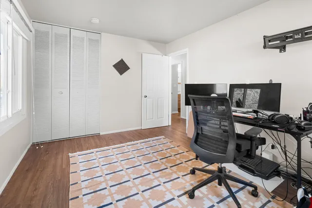 a view of a livingroom with furniture and gym equipment