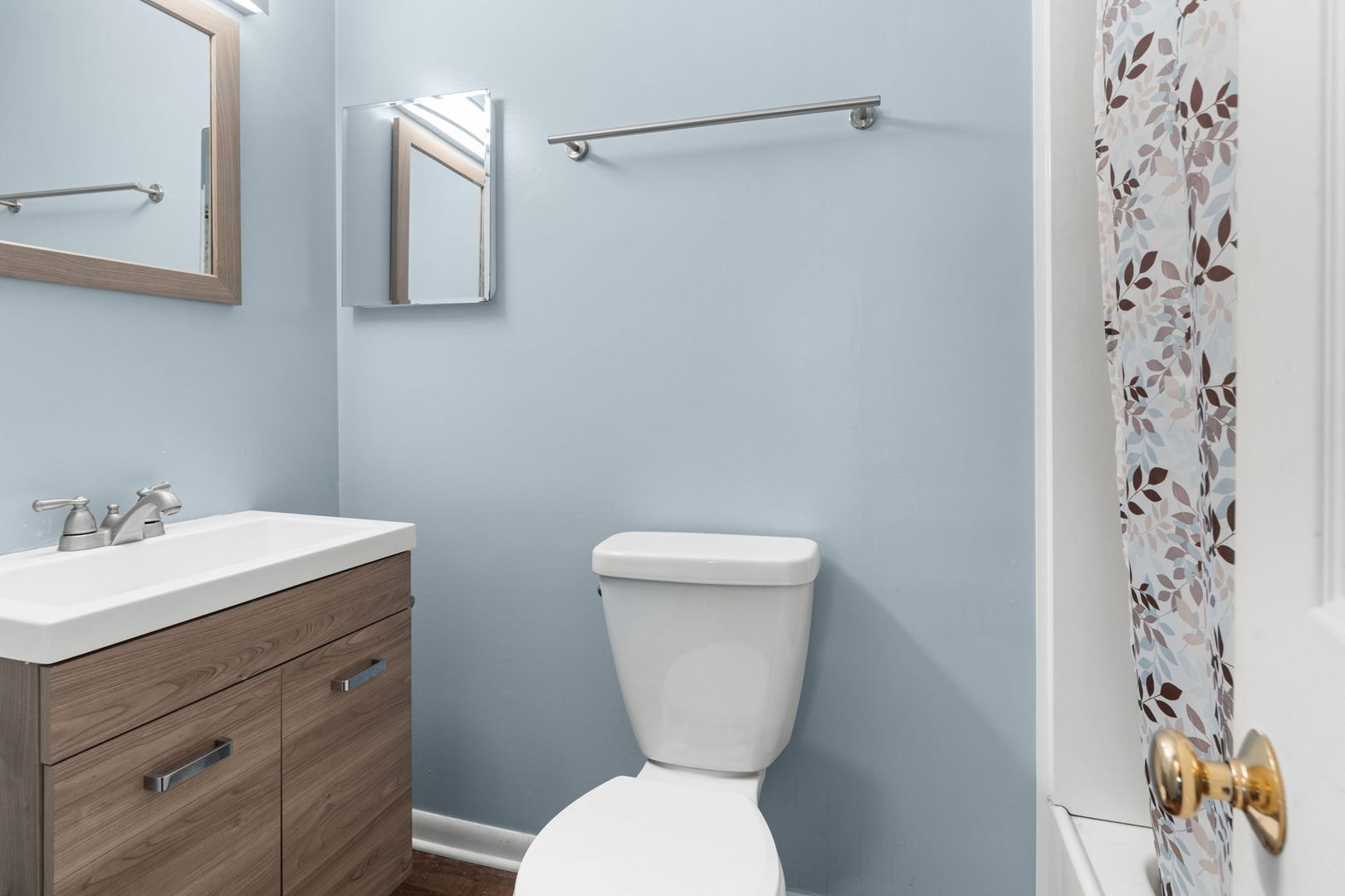 5011-3 Three Oaks Road Crystal Lake, IL 60014 - Photo 10 of 16 a bathroom with a toilet sink and mirror