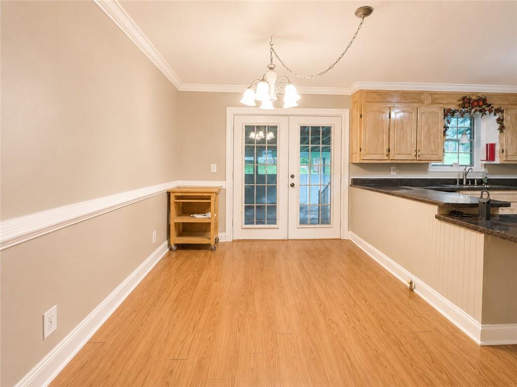 212 Craigtown Road Northeast Calhoun, GA 30701 - Photo 4 of 21 a view of a kitchen with wooden floor and windows