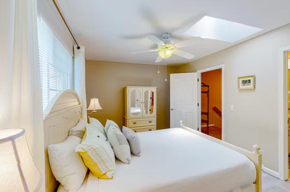 241 Ellis Road, Unit 8 Miramar Beach, FL 32550 - Photo 11 of 29 a bedroom with a bed and ceiling fan