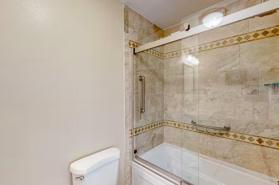 241 Ellis Road, Unit 8 Miramar Beach, FL 32550 - Photo 14 of 29 a bathroom with a shower and a toilet