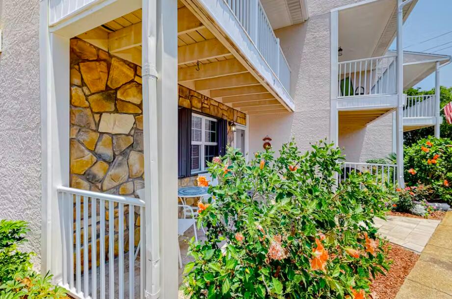 241 Ellis Road, Unit 8 Miramar Beach, FL 32550 - Photo 2 of 29 a view of a house with a small yard and plants