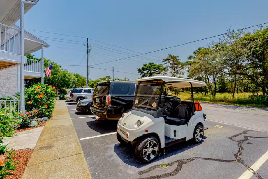 241 Ellis Road, Unit 8 Miramar Beach, FL 32550 - Photo 25 of 29 a car parked in garage of a building