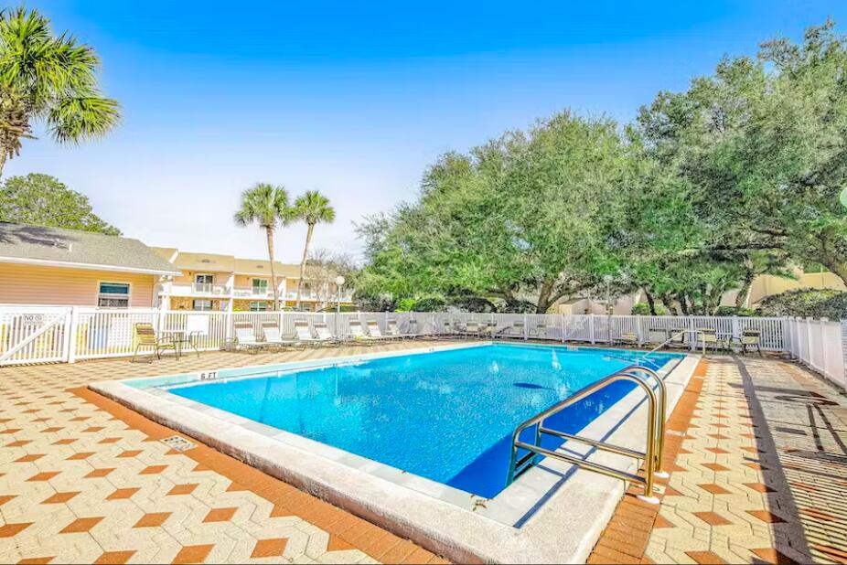 241 Ellis Road, Unit 8 Miramar Beach, FL 32550 - Photo 28 of 29 a view of swimming pool with outdoor seating and plants