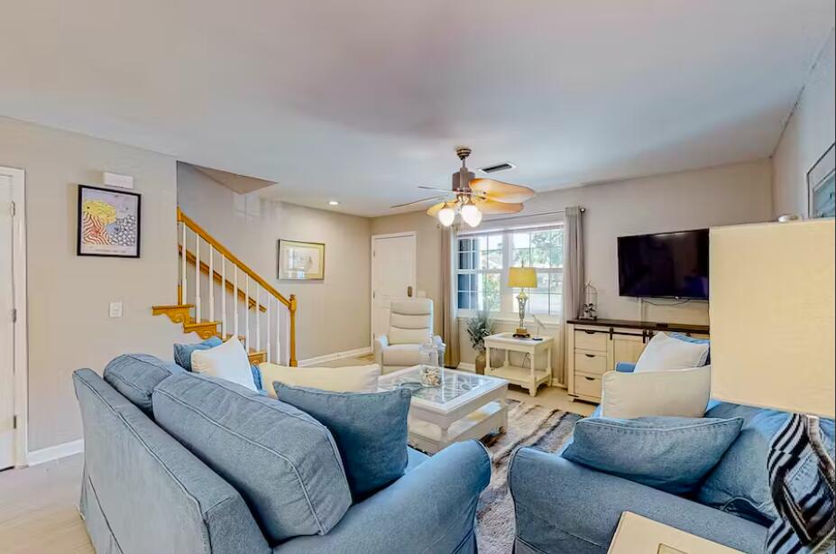 241 Ellis Road, Unit 8 Miramar Beach, FL 32550 - Photo 4 of 29 a living room with furniture and a flat screen tv