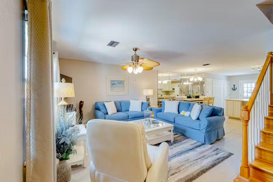 241 Ellis Road, Unit 8 Miramar Beach, FL 32550 - Photo 5 of 29 a living room with furniture and a chandelier