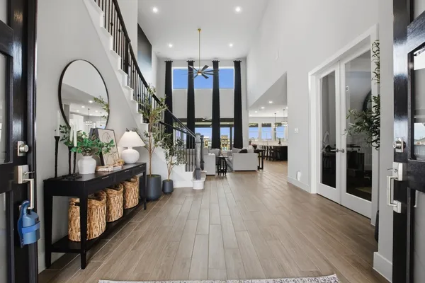 a living room with lots of furniture and a chandelier