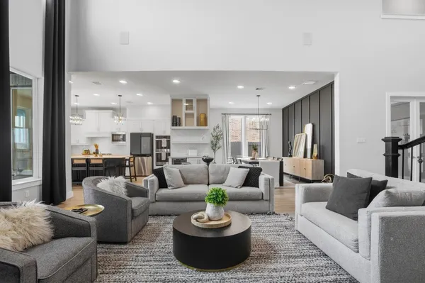 a view of living room with furniture and large windows