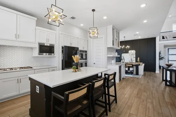 a kitchen with counter space cabinets and appliances