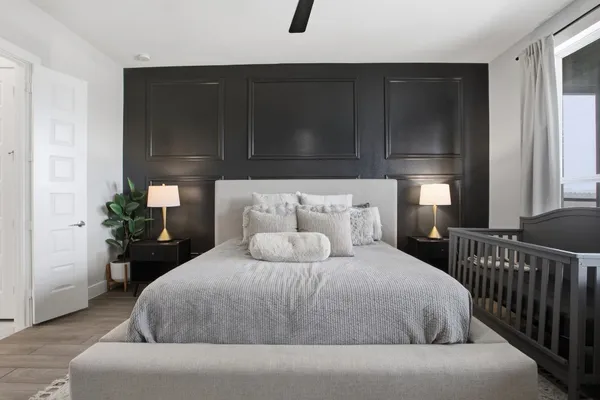 a bedroom with a bed and a flat screen tv