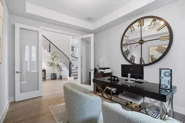 a living room with furniture a rug and a large window