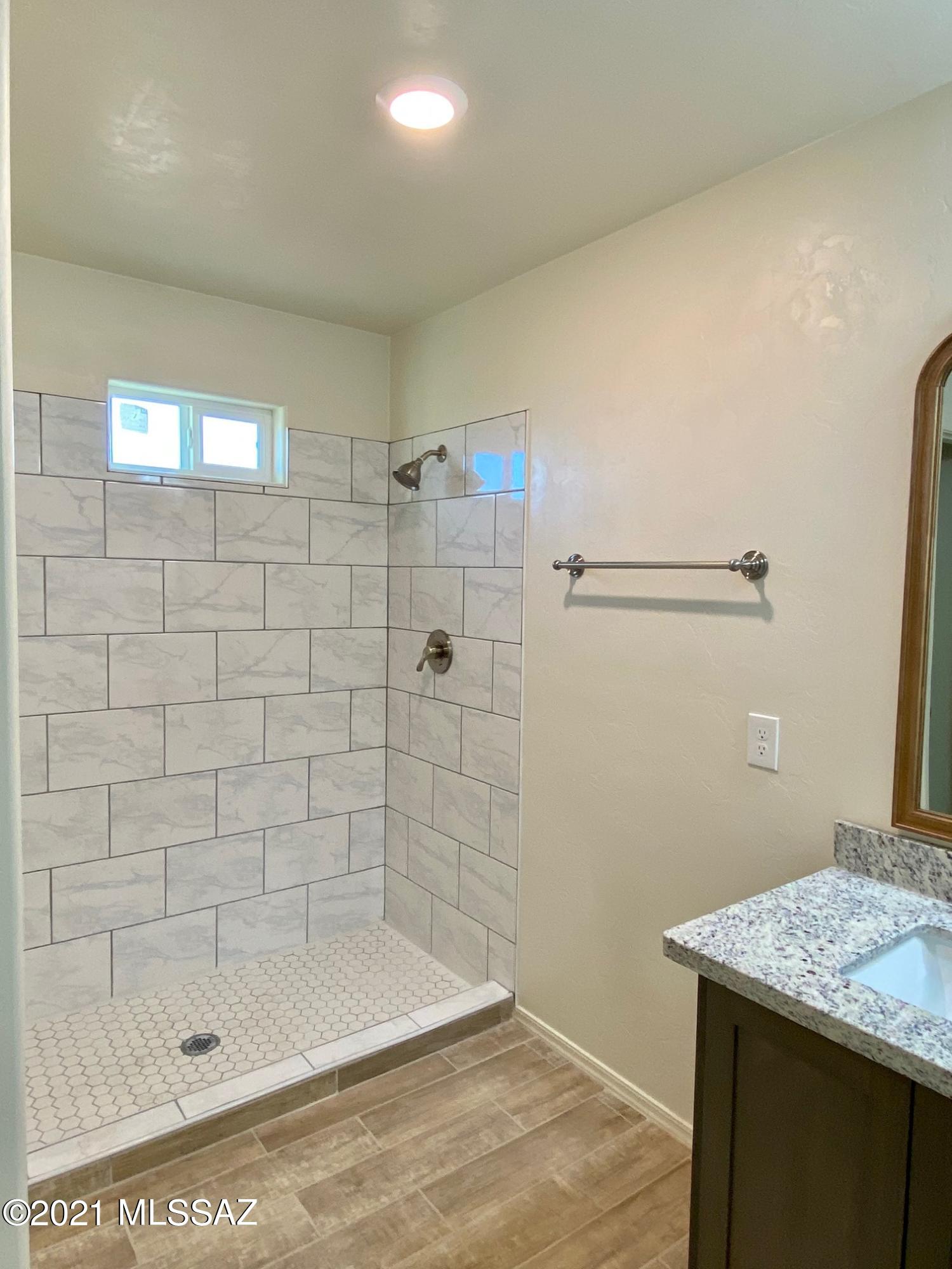 77 Ver Patria Rio Rico, AZ 85648 - Photo 35 of 50 a bathroom with a shower