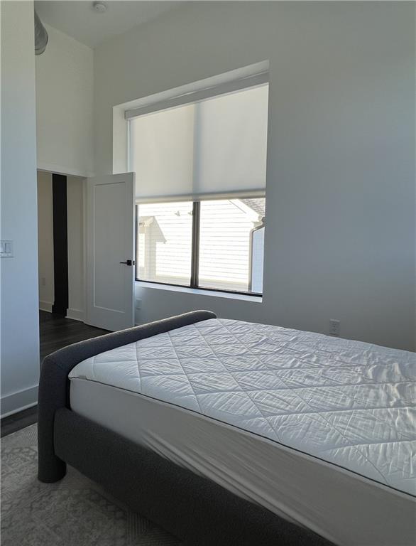 108 Park Place, Unit 311 Decatur, GA 30030 - Photo 16 of 23 a bedroom with a bed and a window