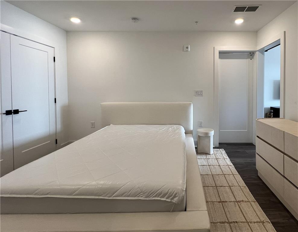 108 Park Place, Unit 311 Decatur, GA 30030 - Photo 21 of 23 a large white bed in a white room