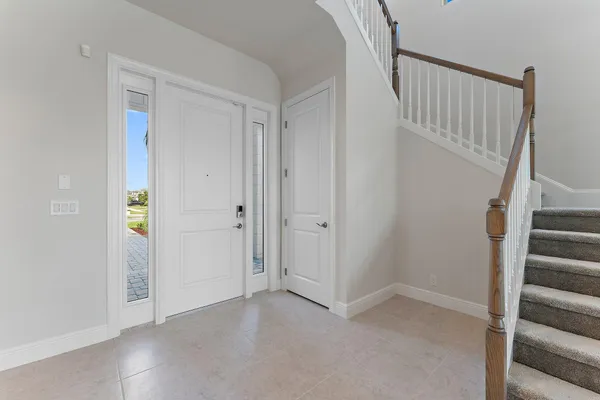a kitchen with kitchen island granite countertop a stove sink and refrigerator