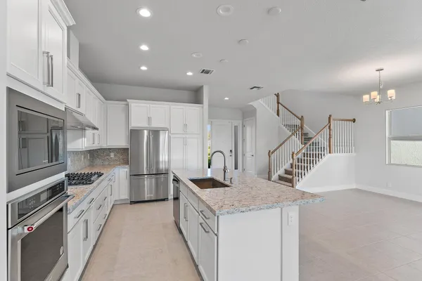 a view of an entryway with wooden floor and windows