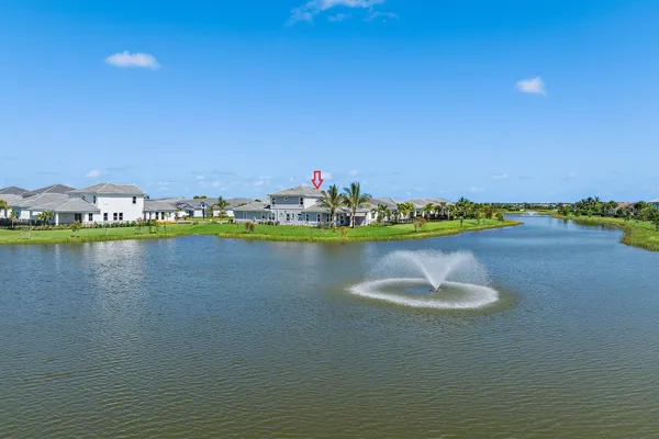 a view of a lake with houses in the back