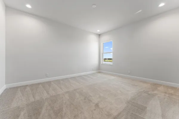 a view of a patio with a table and chairs
